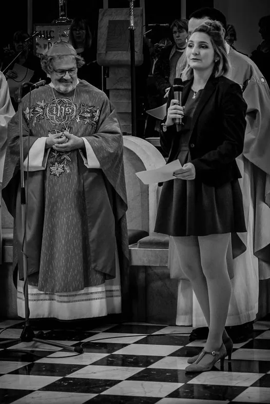 Amusing monochrome photo of priest eying a pretty girl in short skirt.